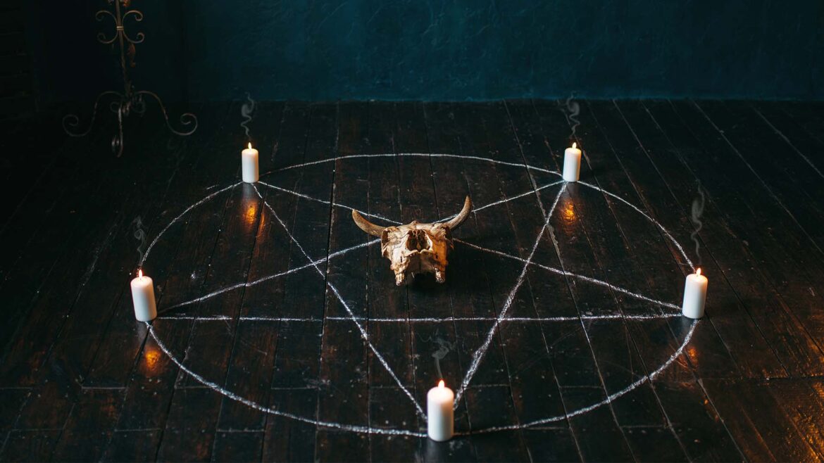 Pentagram with candles and animal skull