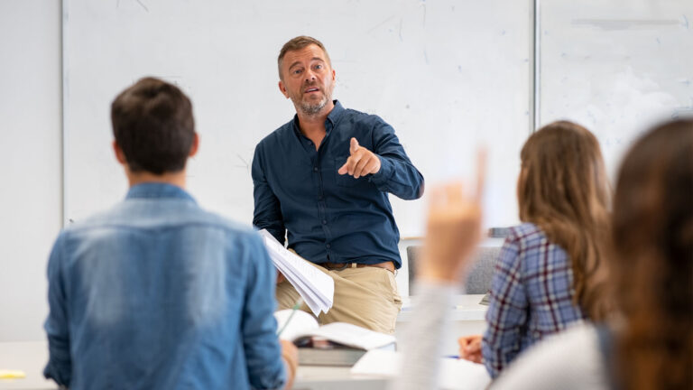 Man teaching in young adult classroom