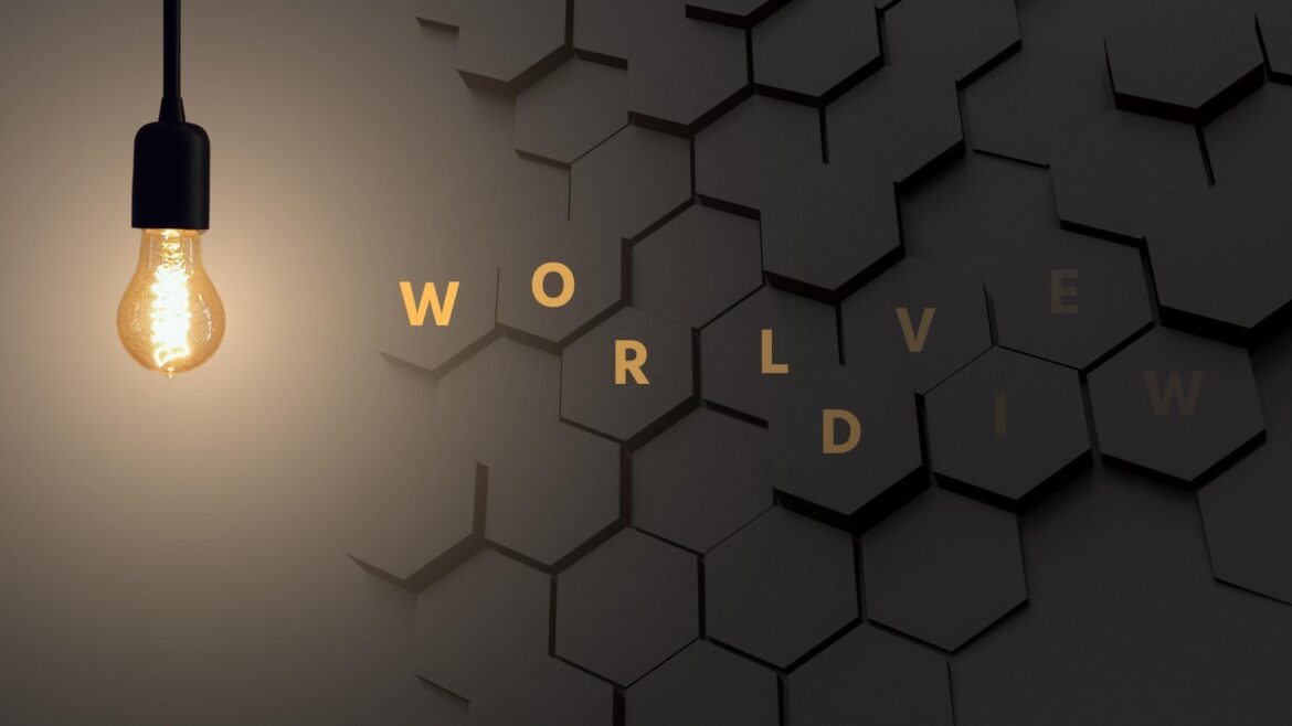 Incandescent light bulb on a dark textured background with the word "Worldview"