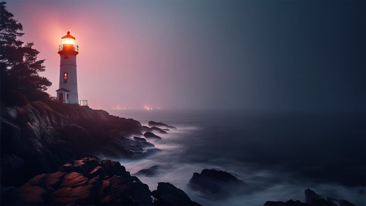 Lighthouse in sunset pink glow along a rocky shore.