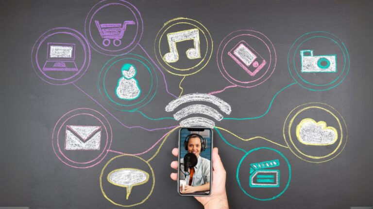 A chalkboard with a collection of symbols on it, including wifi bars, thought bubble, phone, email icon, and more.