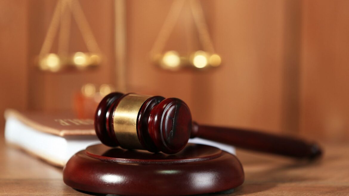 Close-up shot of a judge's gavel resting on it's base.