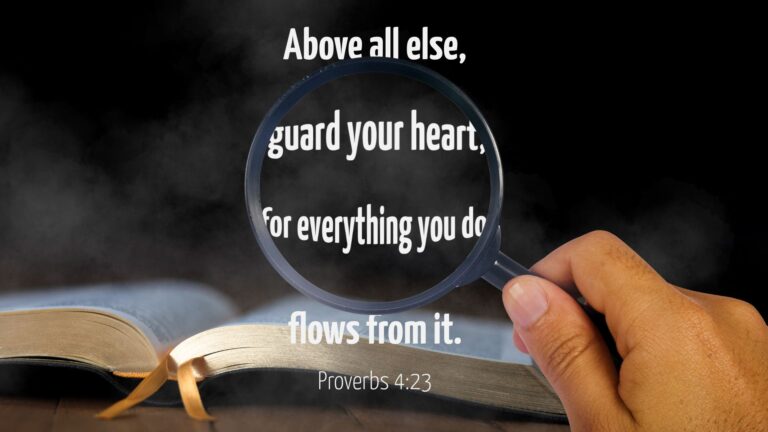 A magnifying glass looking at the verse Proverbs 4:23 over an image of an open bible, exaggerating the center part of the verse, which reads "Above all else, guards your heart, for everything you do flows from it."